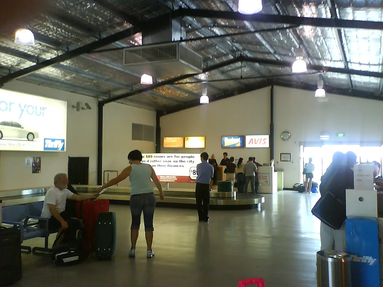 Travellers inside the Avalon Airport terminal hall